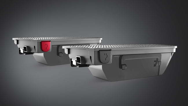 Two ATTO Sport mobility scooter lithium battery packs are shown on a dark studio background.